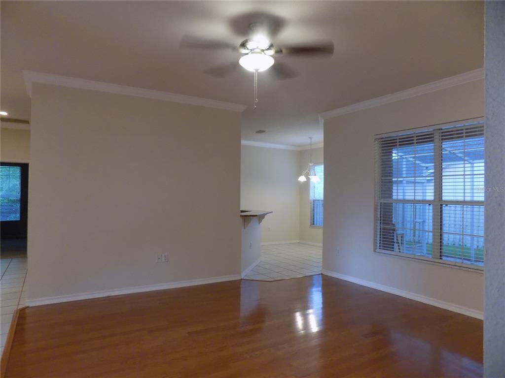 11903 Northwest 9 Road Gainesville, FL 32606 - Photo 13 of 60 a view of a livingroom with a ceiling fan and window