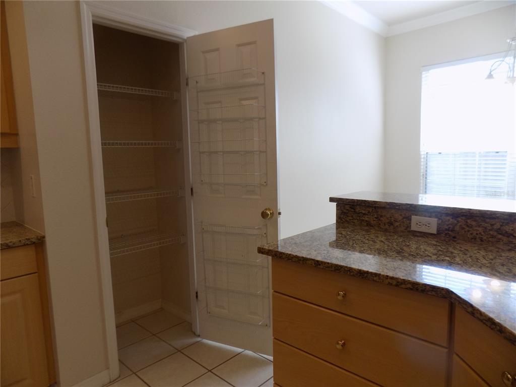 11903 Northwest 9 Road Gainesville, FL 32606 - Photo 26 of 60 a bathroom with a granite countertop sink and shower