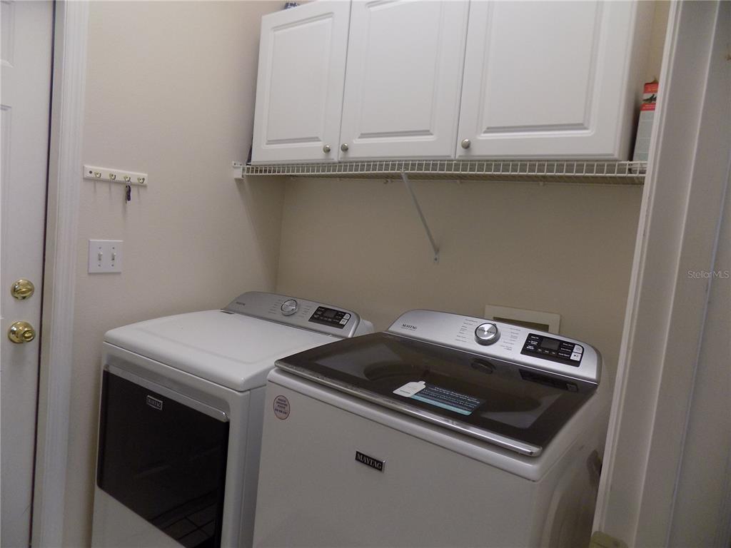 11903 Northwest 9 Road Gainesville, FL 32606 - Photo 27 of 60 a utility room with dryer and washer