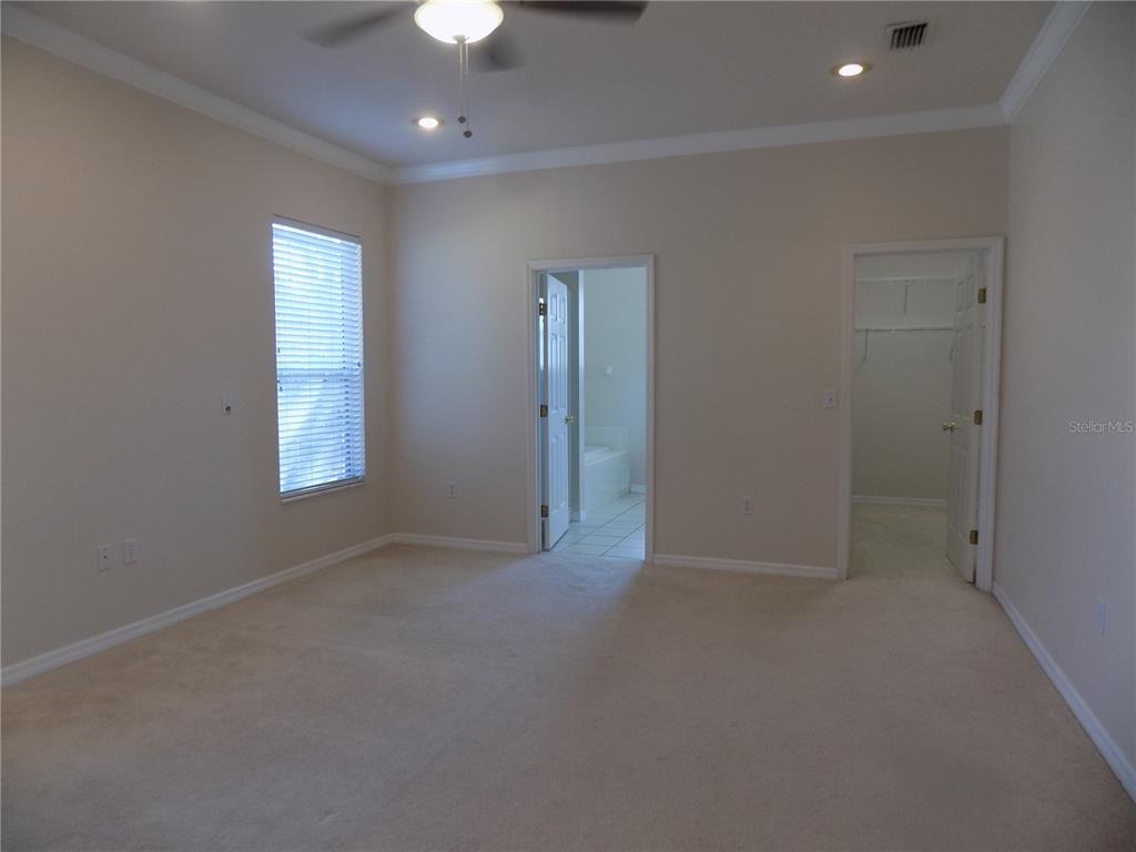 11903 Northwest 9 Road Gainesville, FL 32606 - Photo 37 of 60 an empty room with windows and entrance