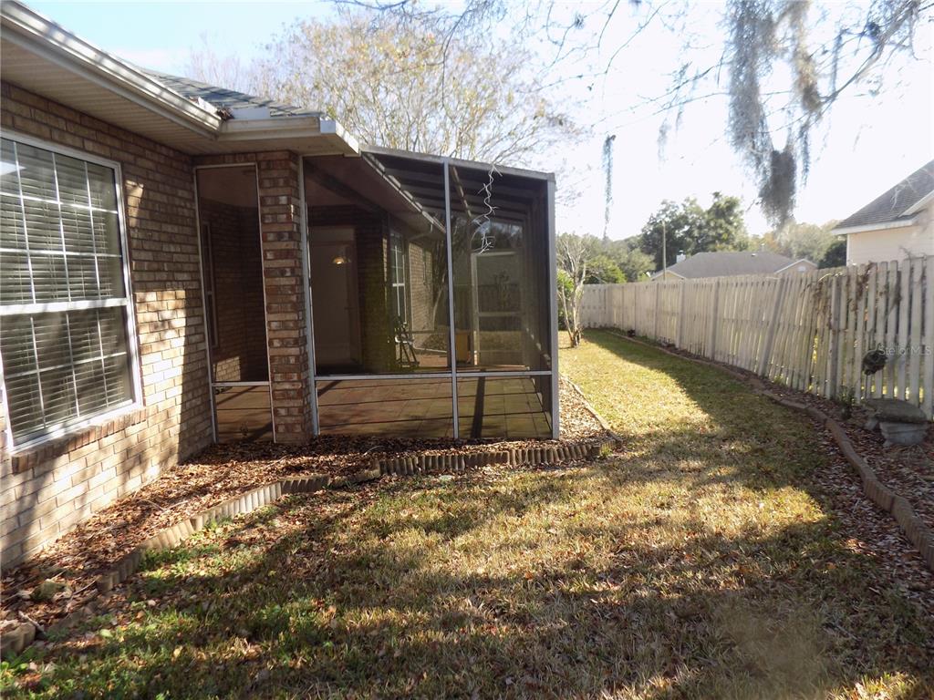 11903 Northwest 9 Road Gainesville, FL 32606 - Photo 59 of 60 a view of a house with backyard and wooden fence