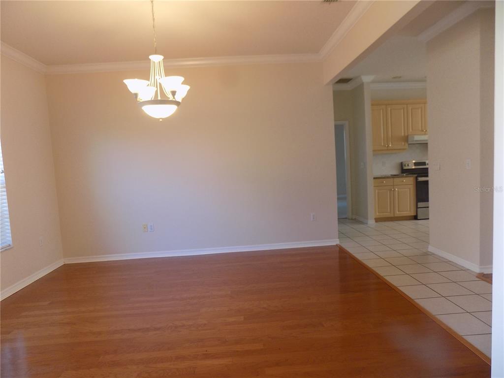11903 Northwest 9 Road Gainesville, FL 32606 - Photo 7 of 60 a view of empty room with wooden floor