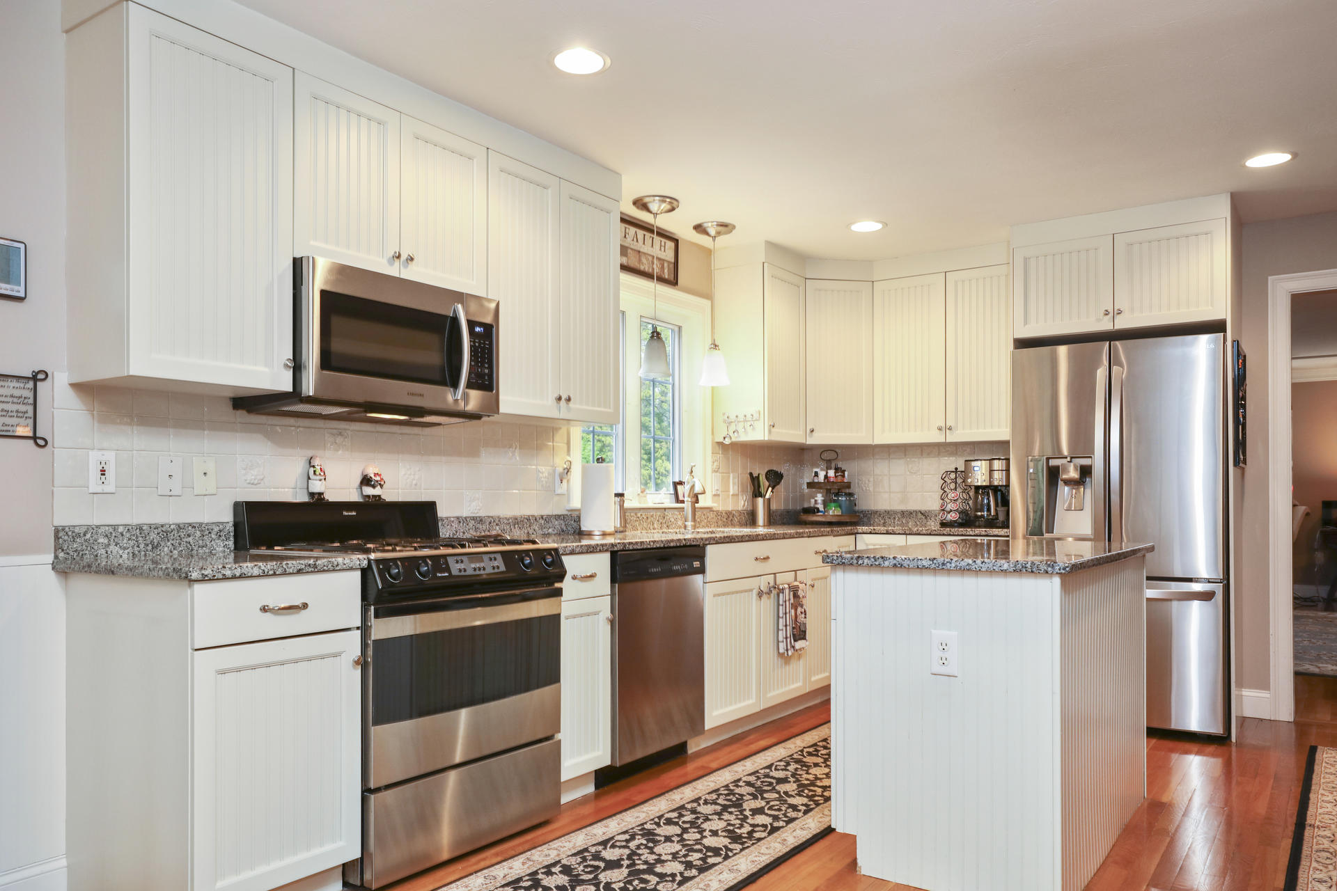 1356 Old Post Road Marstons Mills, MA 02648 - Photo 18 of 53 a kitchen with stainless steel appliances granite countertop a refrigerator stove microwave and sink