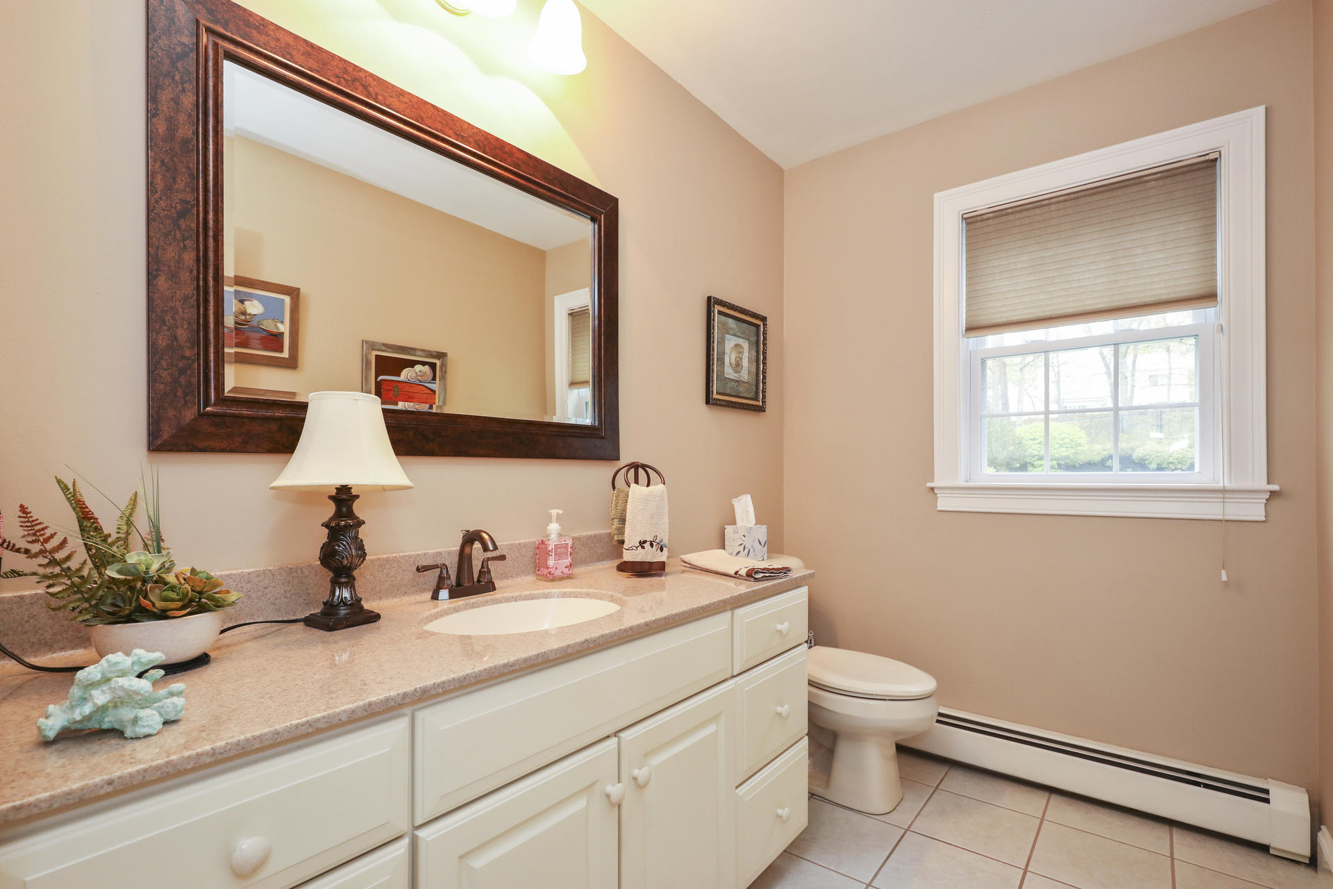 1356 Old Post Road Marstons Mills, MA 02648 - Photo 22 of 53 a bathroom with a toilet sink and mirror