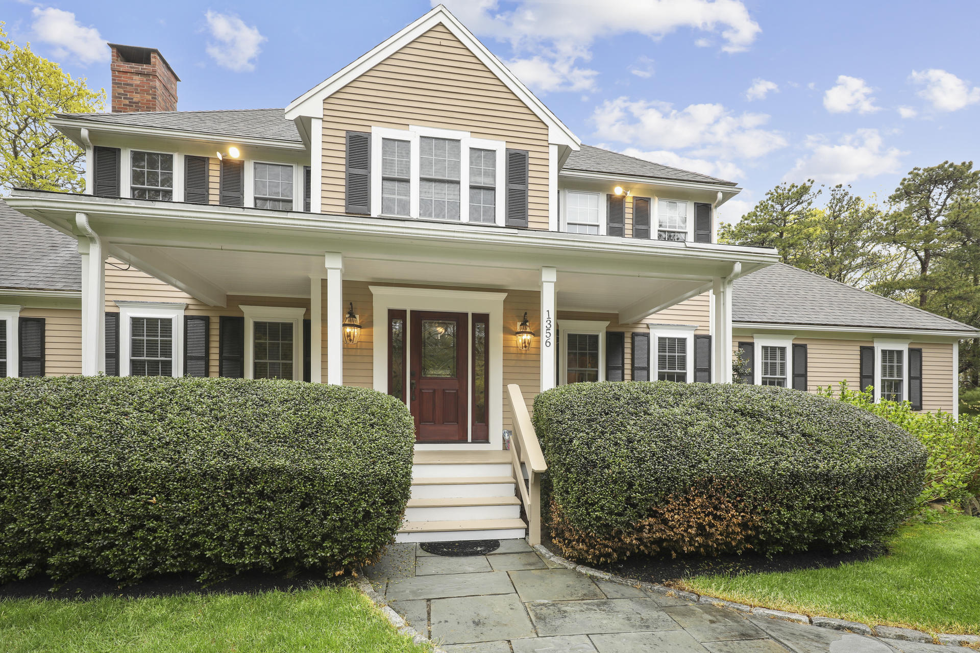 1356 Old Post Road Marstons Mills, MA 02648 - Photo 3 of 53 front view of a house next to a yard