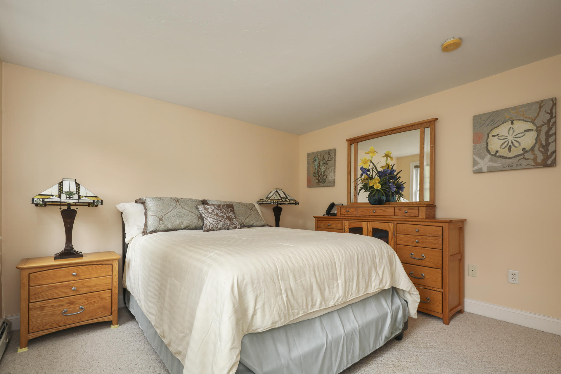 1356 Old Post Road Marstons Mills, MA 02648 - Photo 33 of 53 a bedroom with a bed and a chandelier