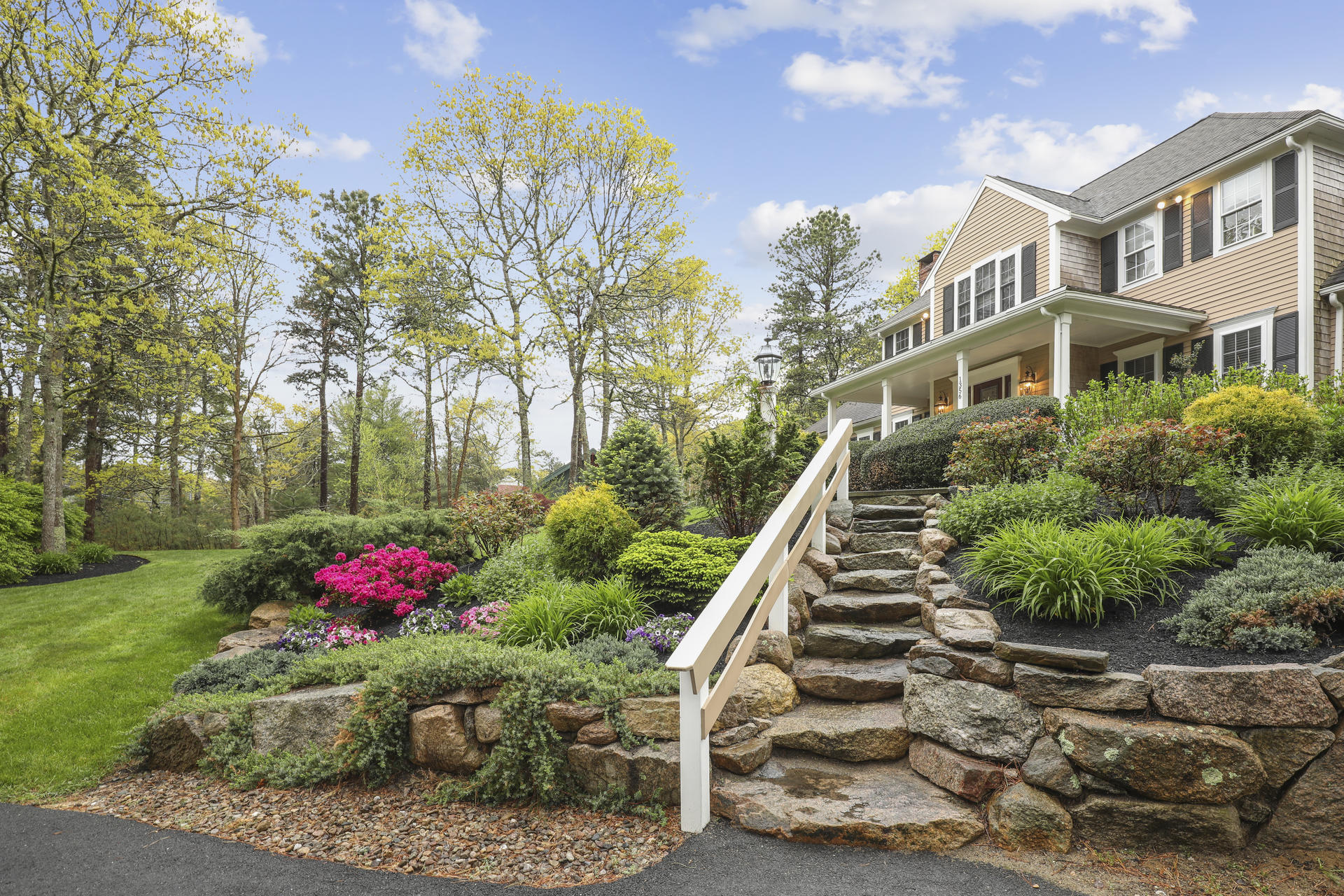 1356 Old Post Road Marstons Mills, MA 02648 - Photo 6 of 53 a view of a garden with plants and a bench