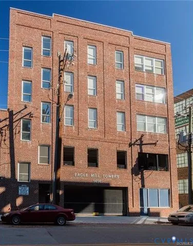 a front view of a building with a street
