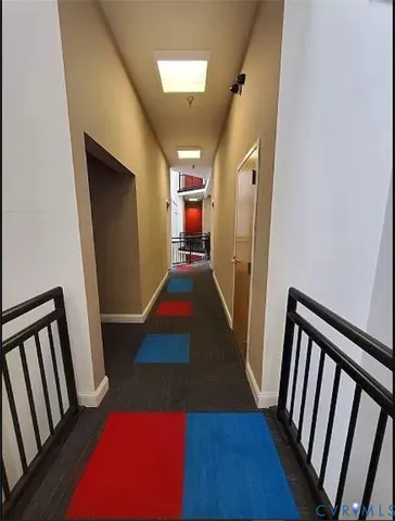 a view of a hallway view with staircase