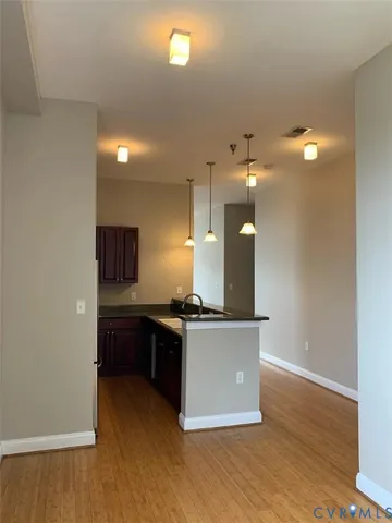 a kitchen with stainless steel appliances granite countertop a stove and a refrigerator