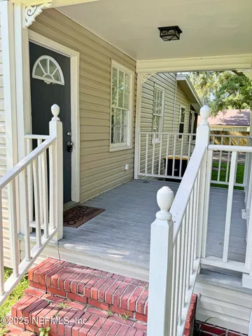 a view of a balcony with staircase