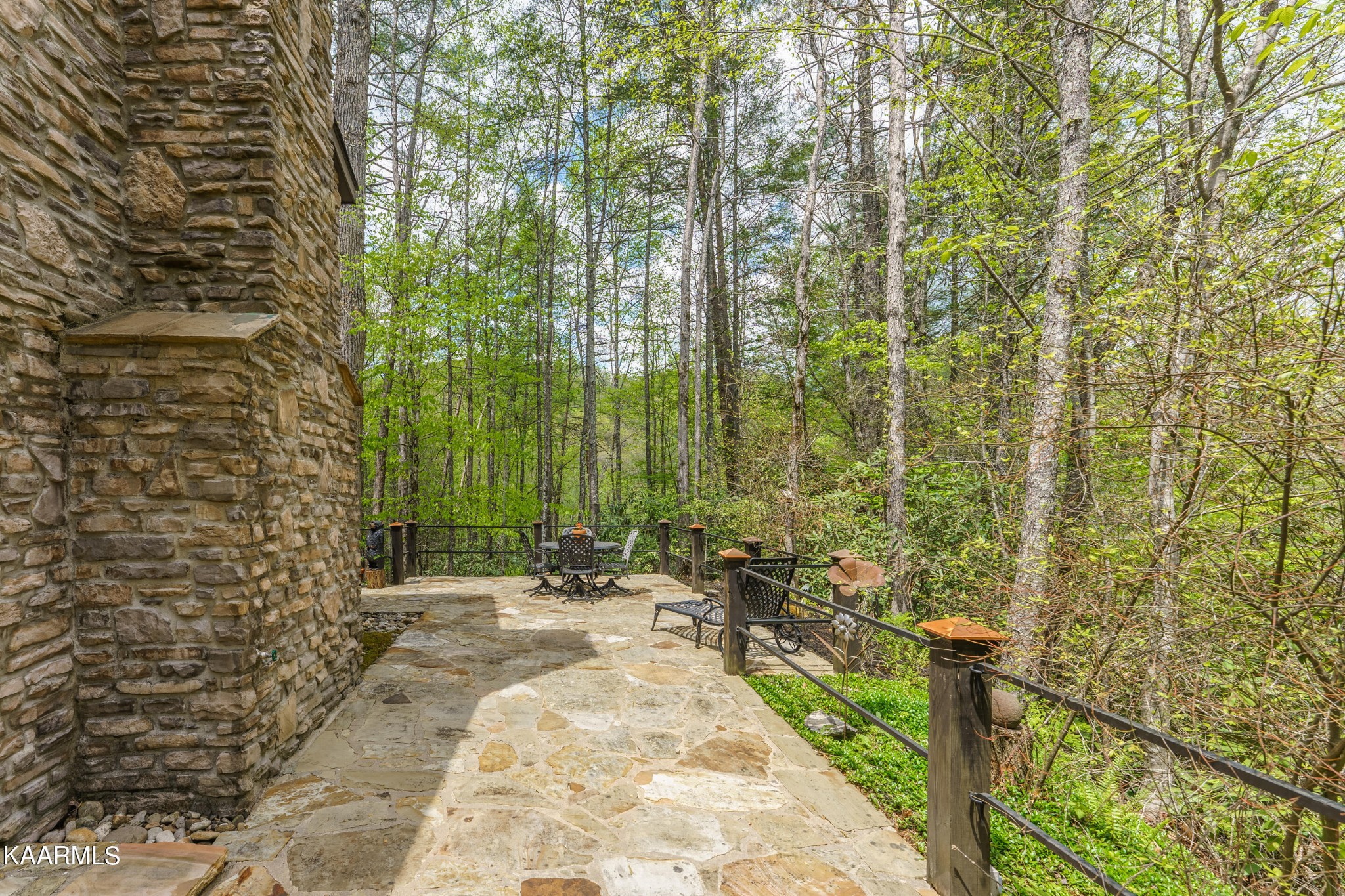4614 Whetstone Road Sevierville, TN 37862 - Photo 51 of 60 a view of a pathway of a park with plants and a bench