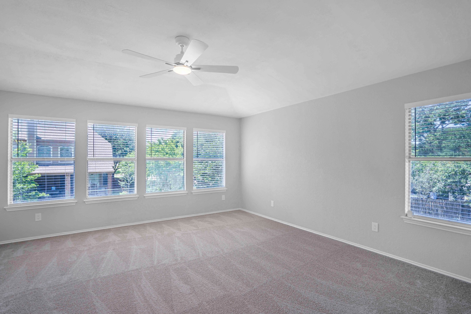 800 Smoke Signal Pass Pflugerville, TX 78660 - Photo 13 of 40 A quiet bedroom with ample natural light from multiple windows and a ceiling fan for comfort.