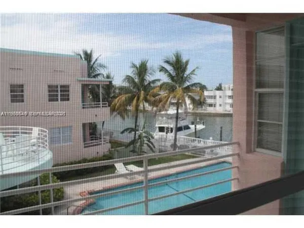 a view of a living room and kitchen