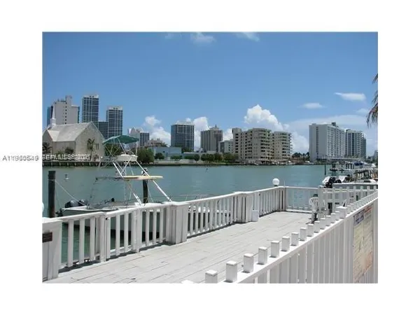 a kitchen with a refrigerator and window