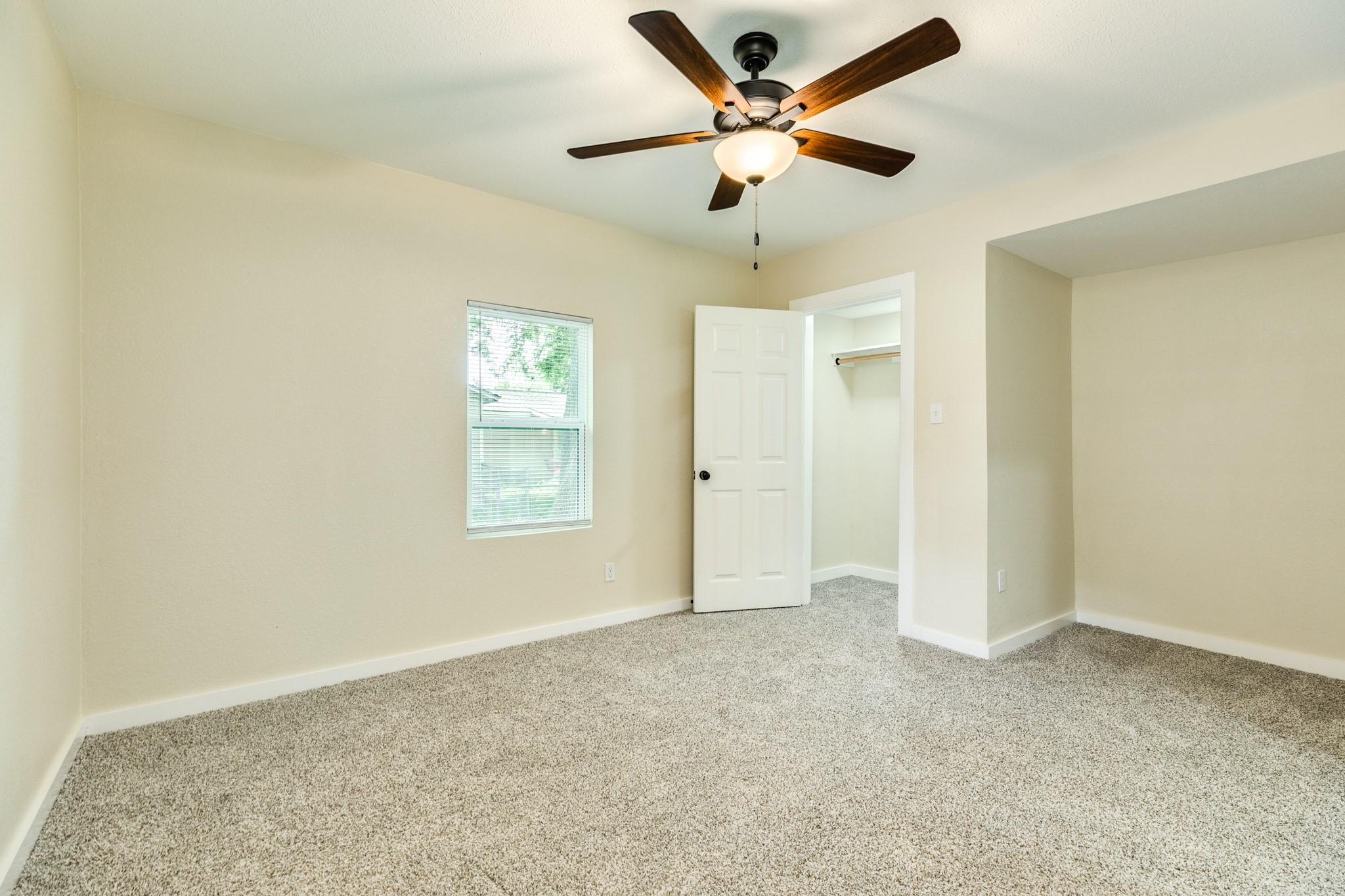 207 Stockman Street Sweeny, TX 77480 - Photo 18 of 22 an empty room with fan and windows