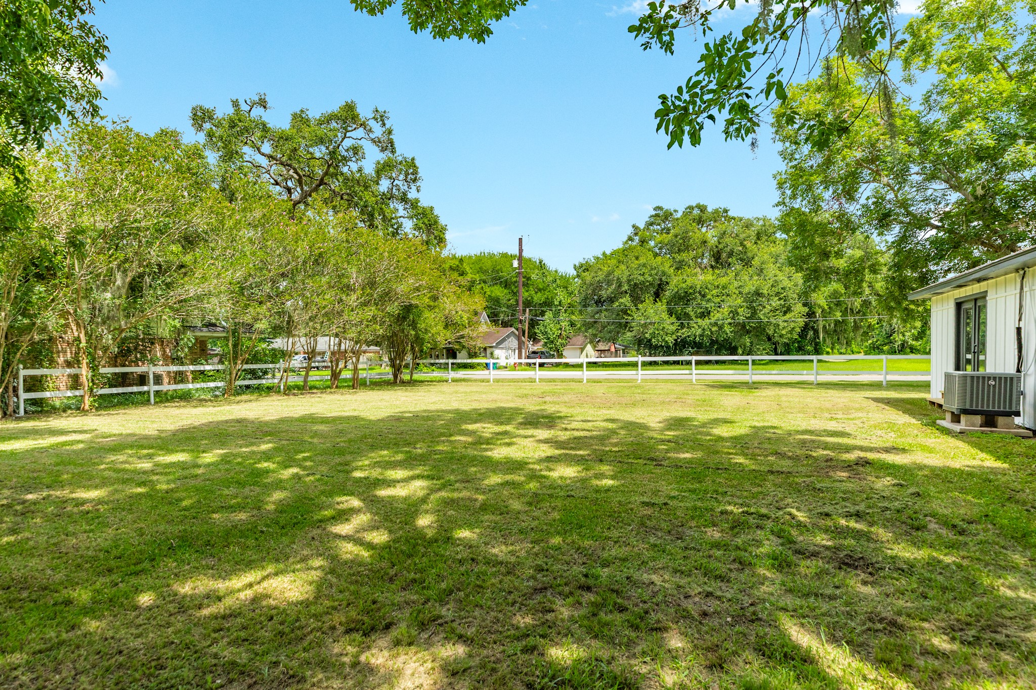 207 Stockman Street Sweeny, TX 77480 - Photo 22 of 22 a view of outdoor space with deck and trees