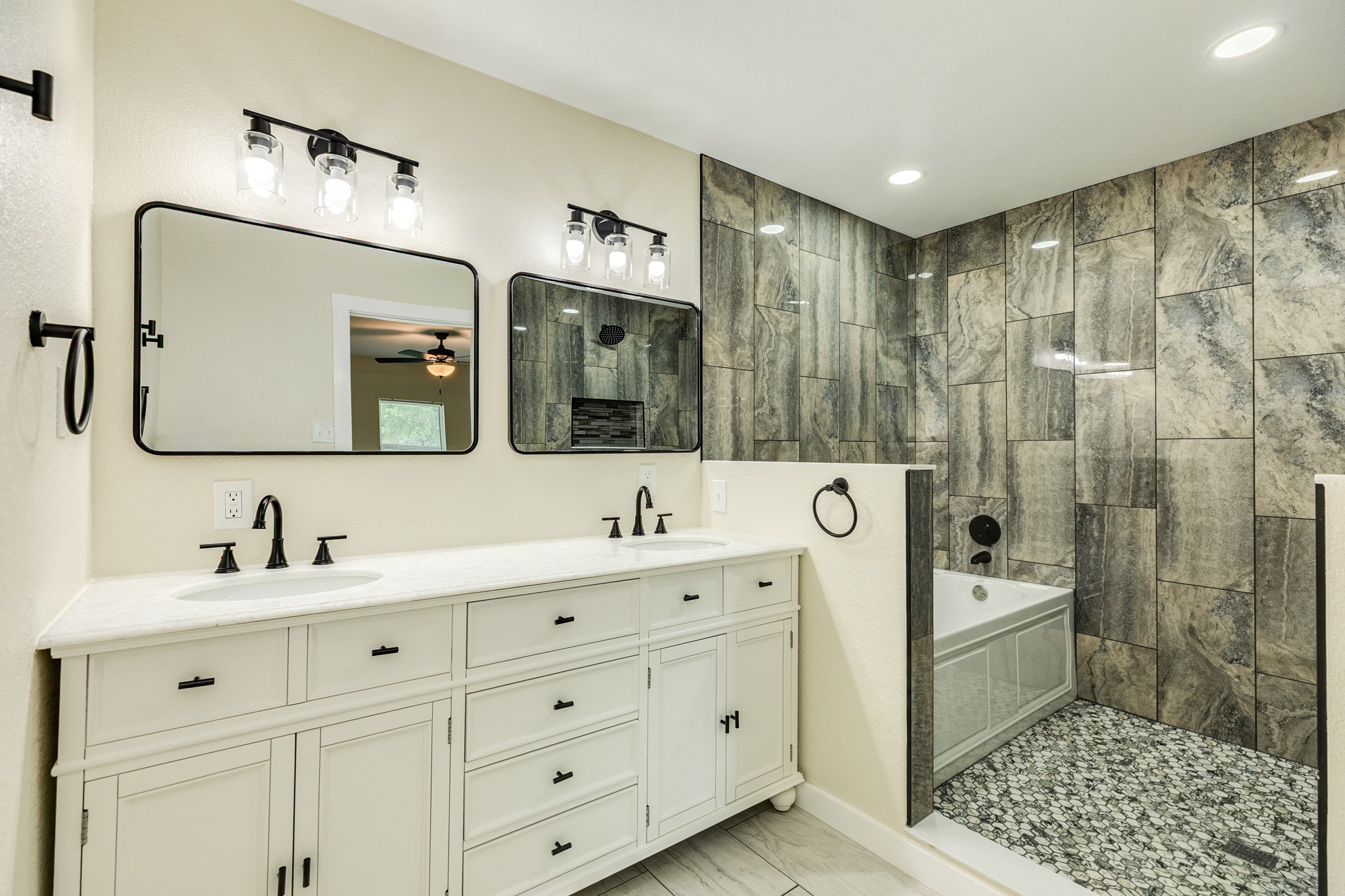 207 Stockman Street Sweeny, TX 77480 - Photo 5 of 22 a bathroom with a double vanity sink mirror and shower