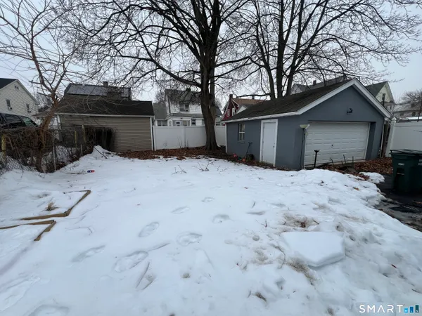 a view of garage yard and tree