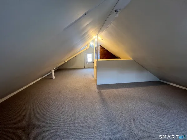 a view of an empty room with windows