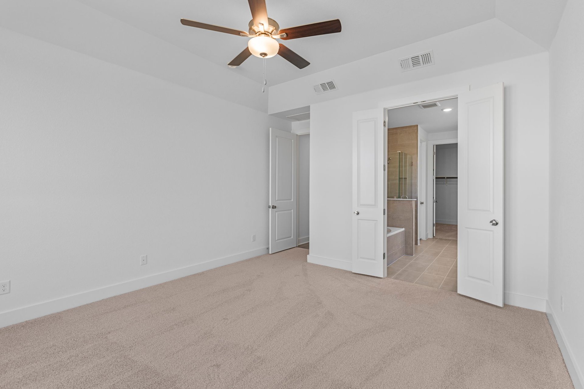 200 Wild Lily Trail Georgetown, TX 78628 - Photo 20 of 38 Primary Bedroom with elevated ceiling