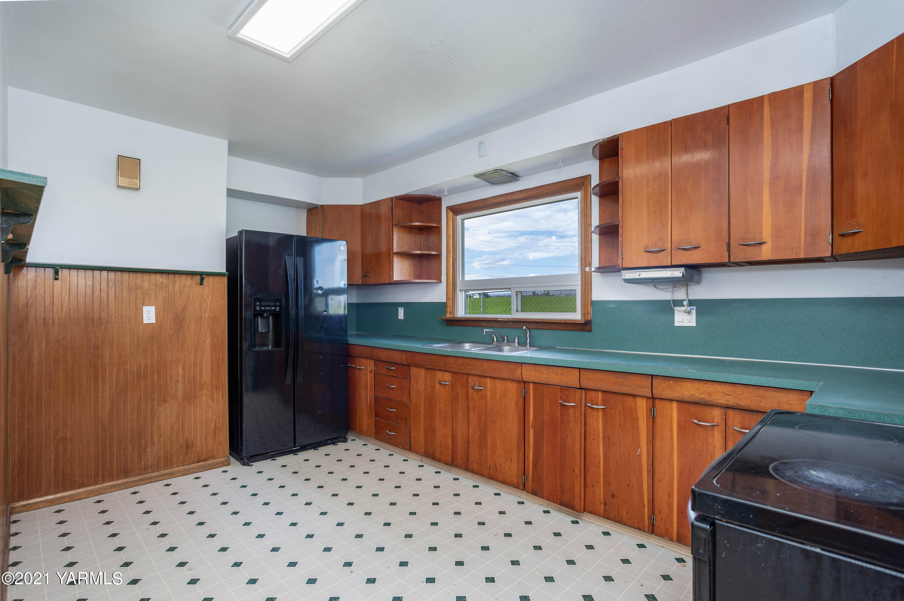 871 Reeves Road Outlook, WA 98938 - Photo 8 of 22 a kitchen with stainless steel appliances a refrigerator and a sink
