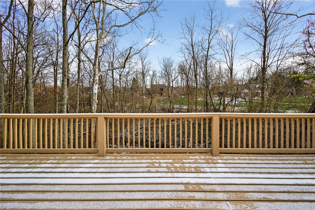 811 Wind Bluff Point Springboro, OH 45066 - Photo 49 of 51 This spacious deck offers serene views of mature trees, ideal for outdoor relaxation and entertaining.