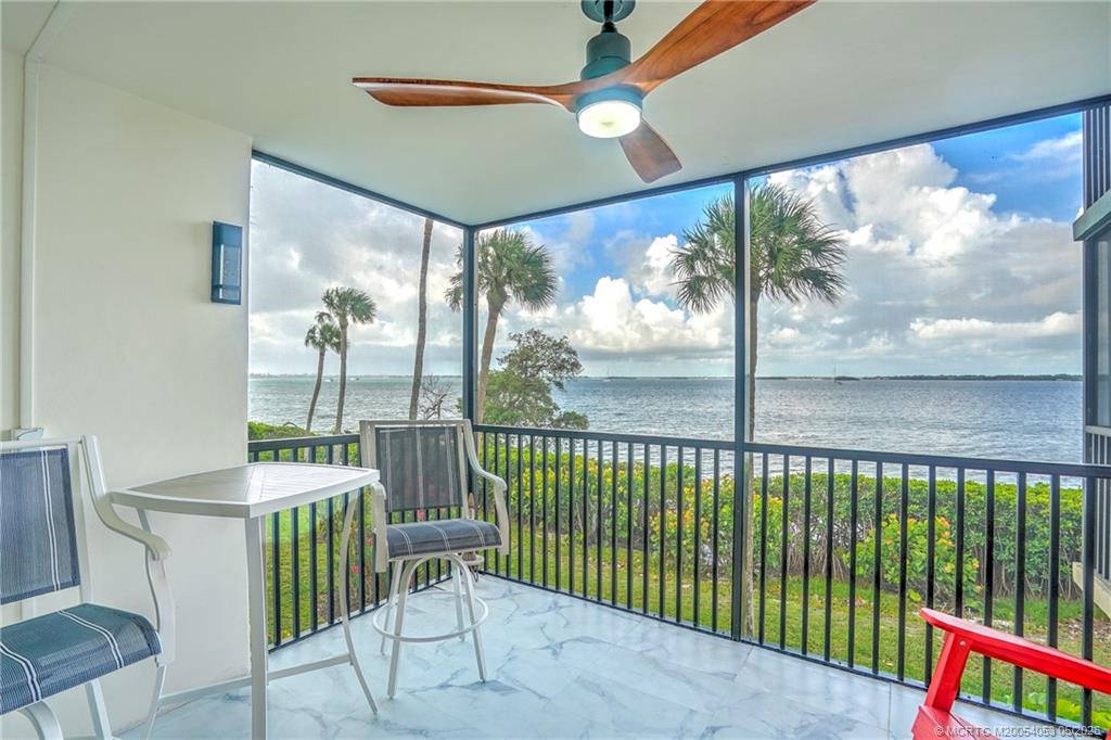 10 Northeast Plantation Road, Unit 101 Jensen Beach, FL 34957 - Photo 13 of 53 a view of a porch with furniture