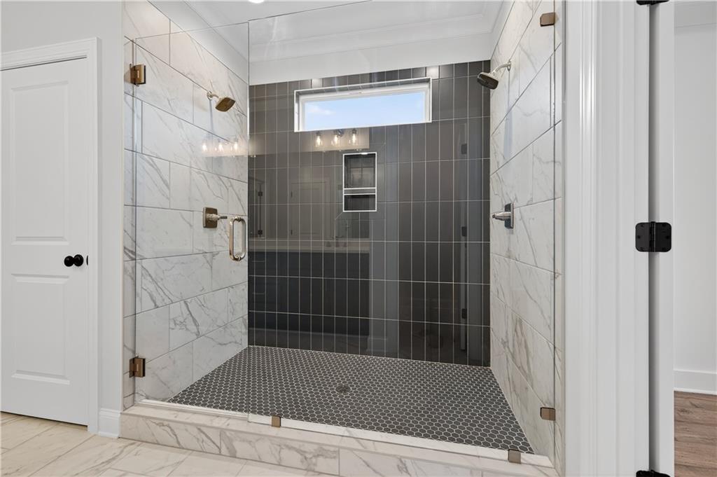 3787 Cheyenne Lane Jefferson, GA 30549 - Photo 44 of 82 a bathroom with a bath tub and shower