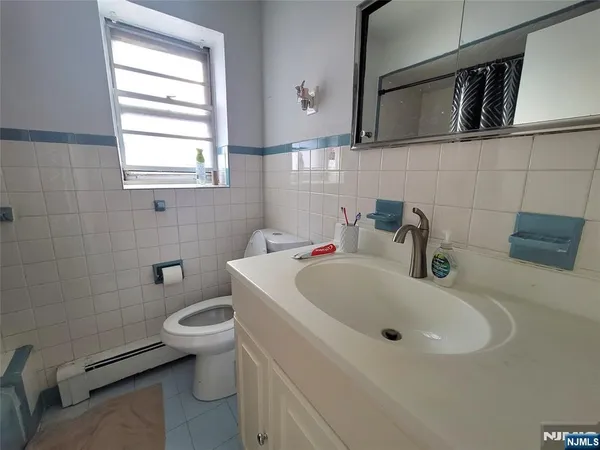 a bathroom with a sink and a toilet