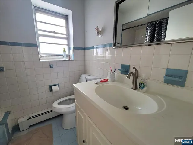 a bathroom with a sink and a toilet
