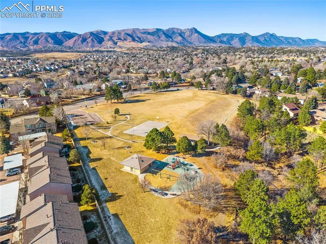 an aerial view of residential building with parking space