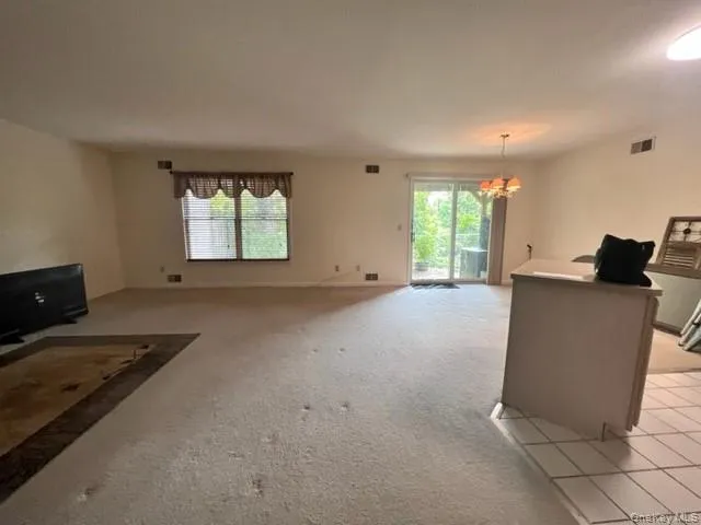 a kitchen with a white cabinets and white appliances
