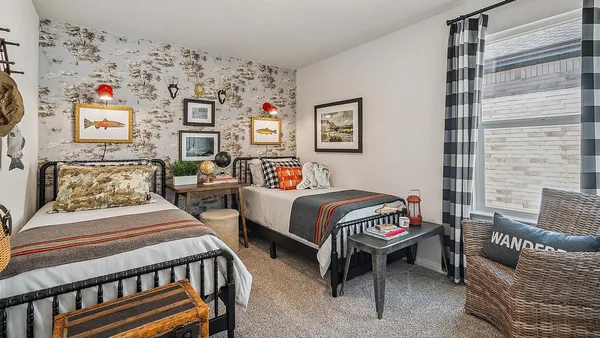 a bedroom with furniture and a window