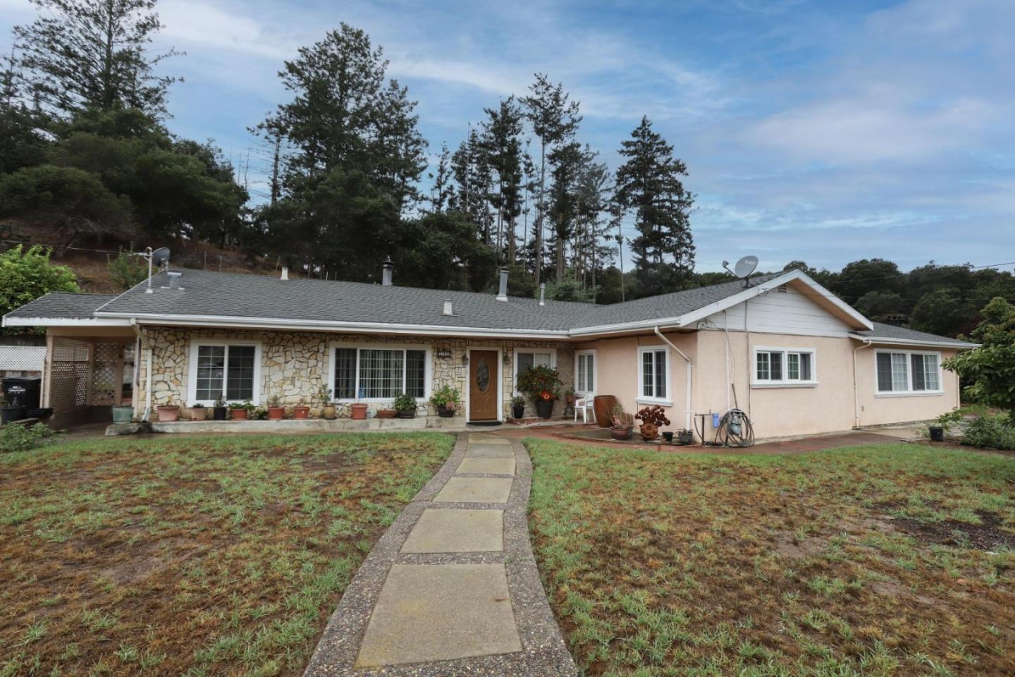 a front view of a house with a yard