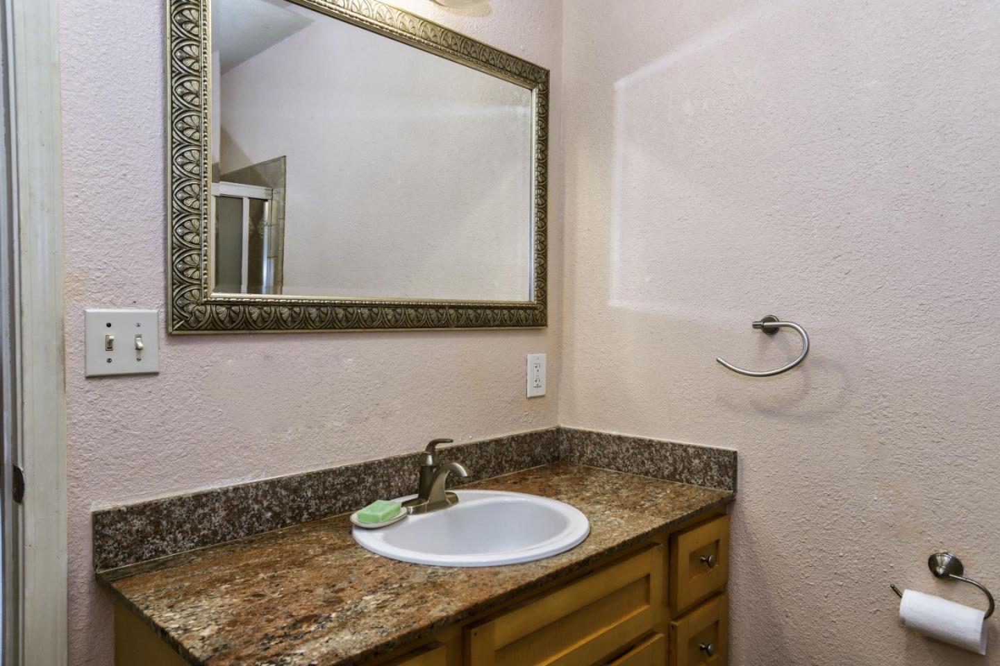 746 Echo Valley Road Salinas, CA 93907 - Photo 18 of 54 a bathroom with a sink and a mirror