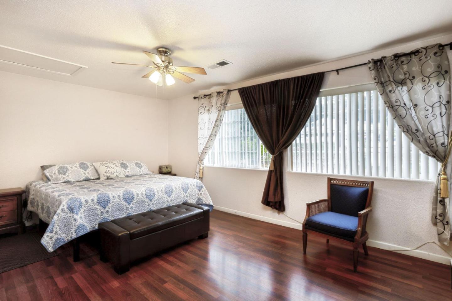 746 Echo Valley Road Salinas, CA 93907 - Photo 21 of 54 a bedroom with a bed and a couch