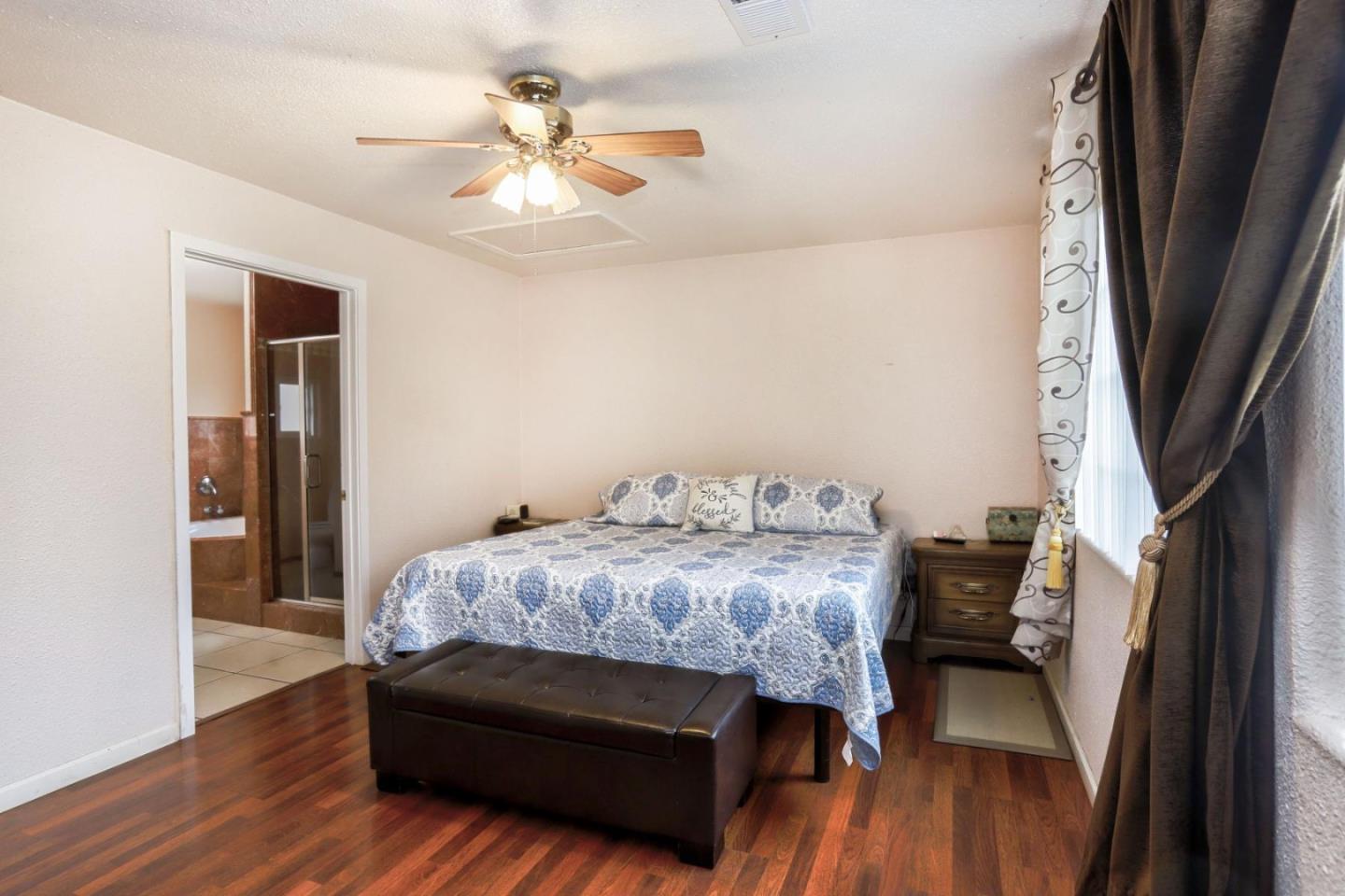 746 Echo Valley Road Salinas, CA 93907 - Photo 22 of 54 a bedroom with a bed and a table