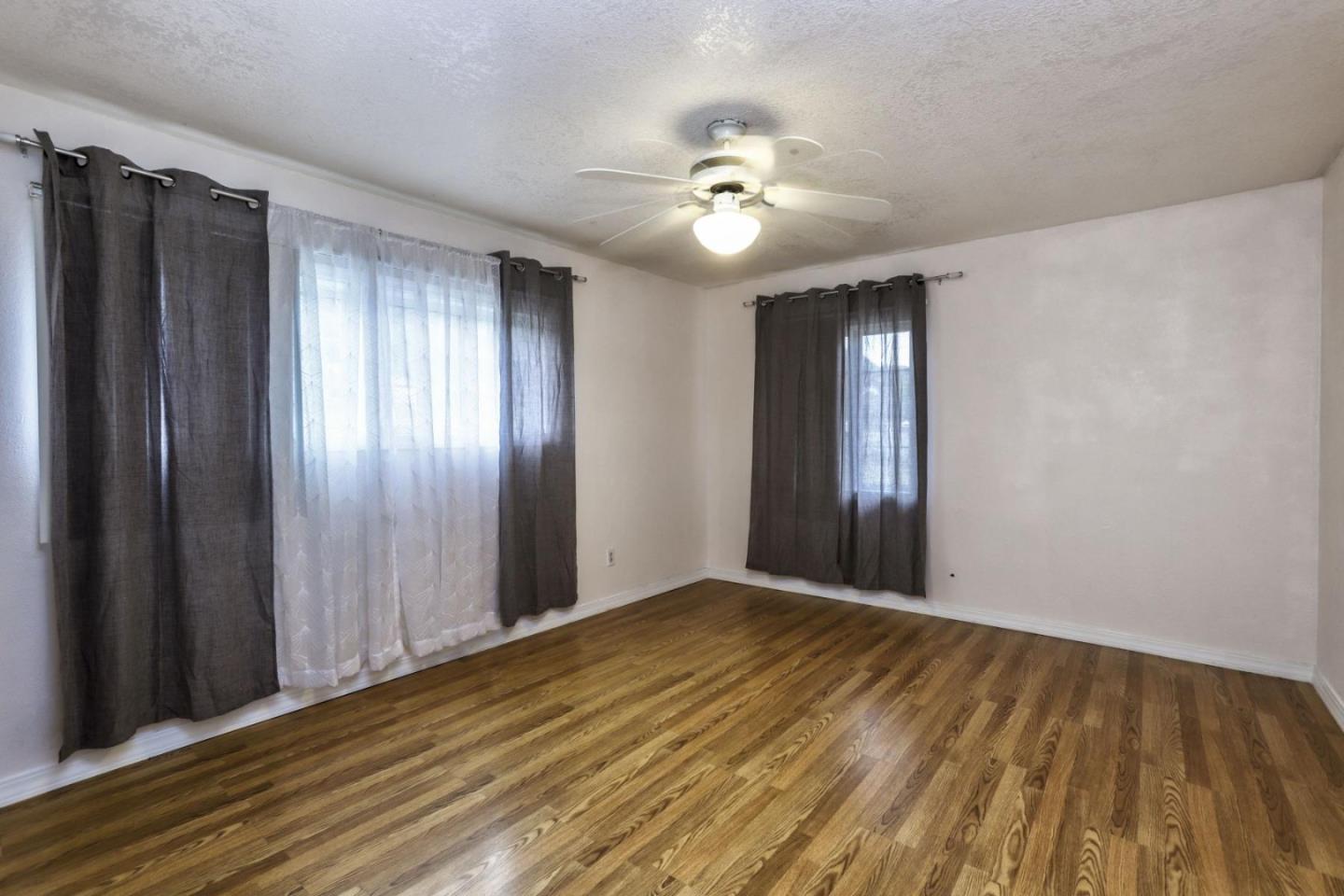 746 Echo Valley Road Salinas, CA 93907 - Photo 33 of 54 a view of an empty room with wooden floor
