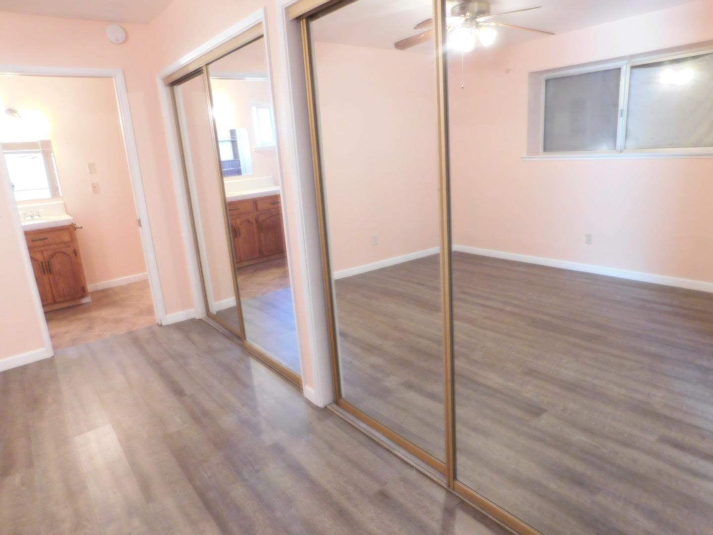 746 Echo Valley Road Salinas, CA 93907 - Photo 45 of 54 wooden floor in an empty room with a mirror