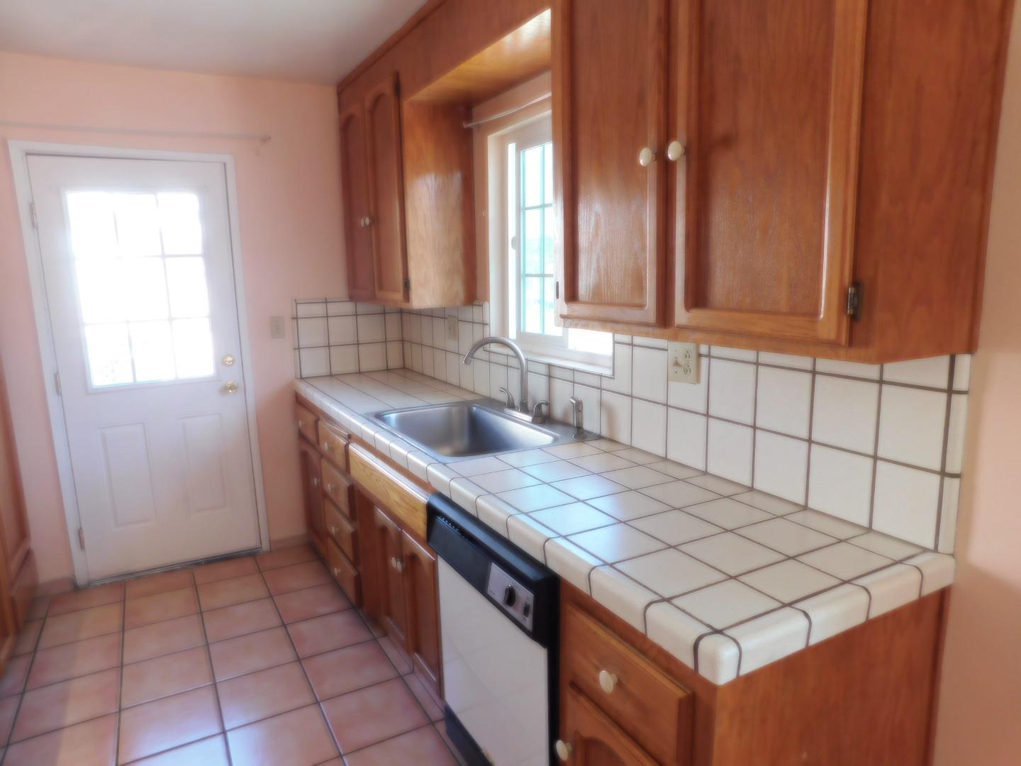 746 Echo Valley Road Salinas, CA 93907 - Photo 49 of 54 a kitchen with a sink stove and cabinets