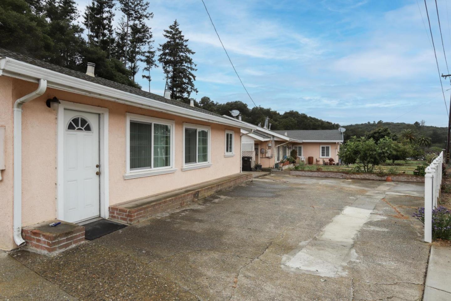 746 Echo Valley Road Salinas, CA 93907 - Photo 5 of 54 a front view of a house with a yard and garage