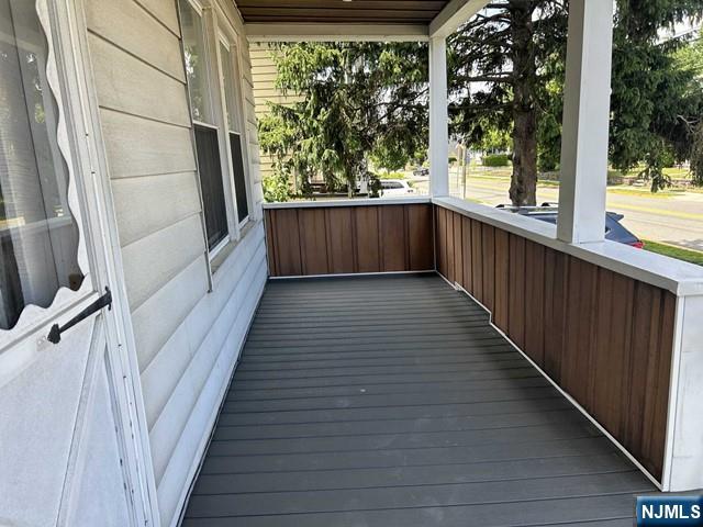 136 Carlton Avenue, Unit 1 East Rutherford, NJ 07073 - Photo 16 of 18 a view of a balcony with wooden floor