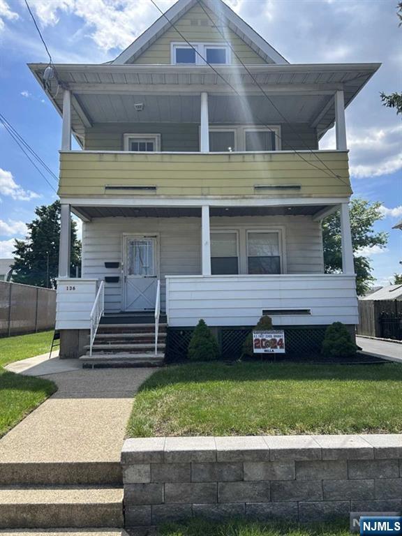 136 Carlton Avenue, Unit 1 East Rutherford, NJ 07073 - Photo 17 of 17 a front view of a house with a garden