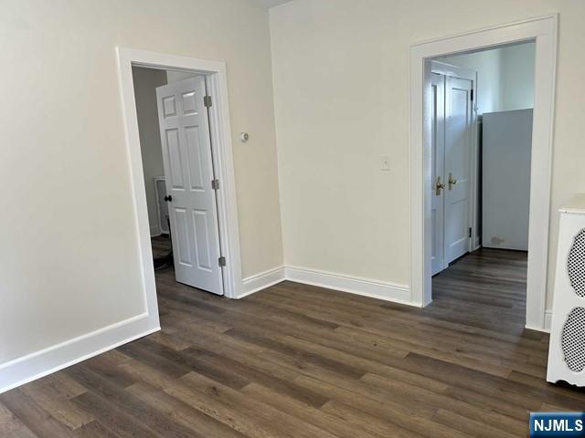 136 Carlton Avenue, Unit 1 East Rutherford, NJ 07073 - Photo 6 of 18 a view of a hallway with wooden floor