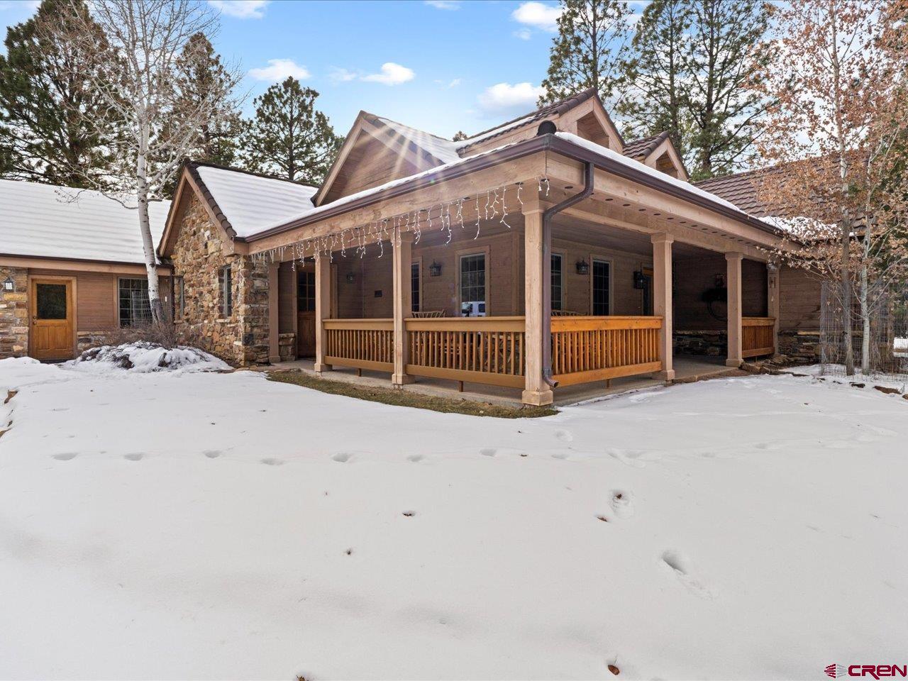 203 Puma Lane Ridgway, CO 81432 - Photo 12 of 43 a view of a house with a yard covered in snow