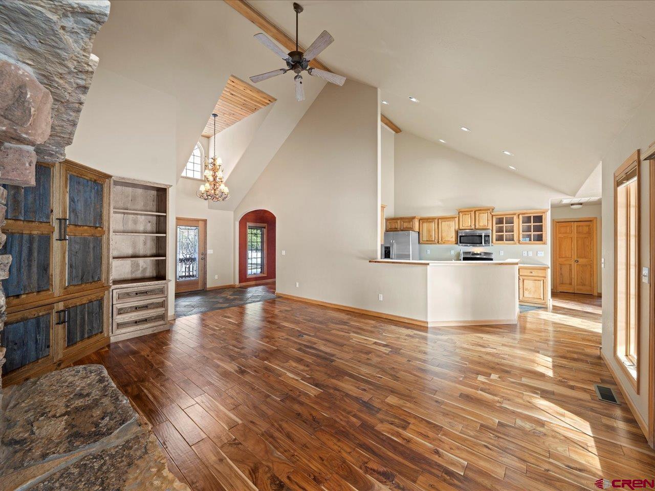 203 Puma Lane Ridgway, CO 81432 - Photo 18 of 43 a view of a living room a kitchen island with wooden floor and cabinets