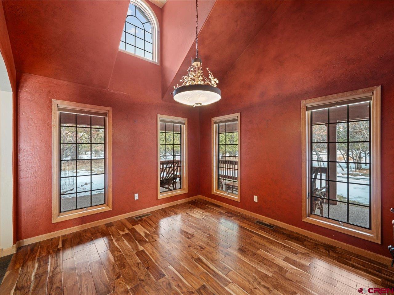 203 Puma Lane Ridgway, CO 81432 - Photo 20 of 43 wooden floor and windows in an empty room