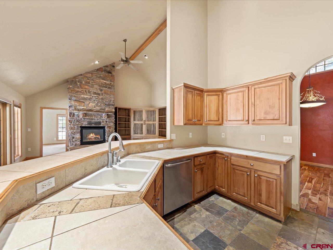 203 Puma Lane Ridgway, CO 81432 - Photo 24 of 43 a large kitchen with kitchen island a sink stainless steel appliances and cabinets