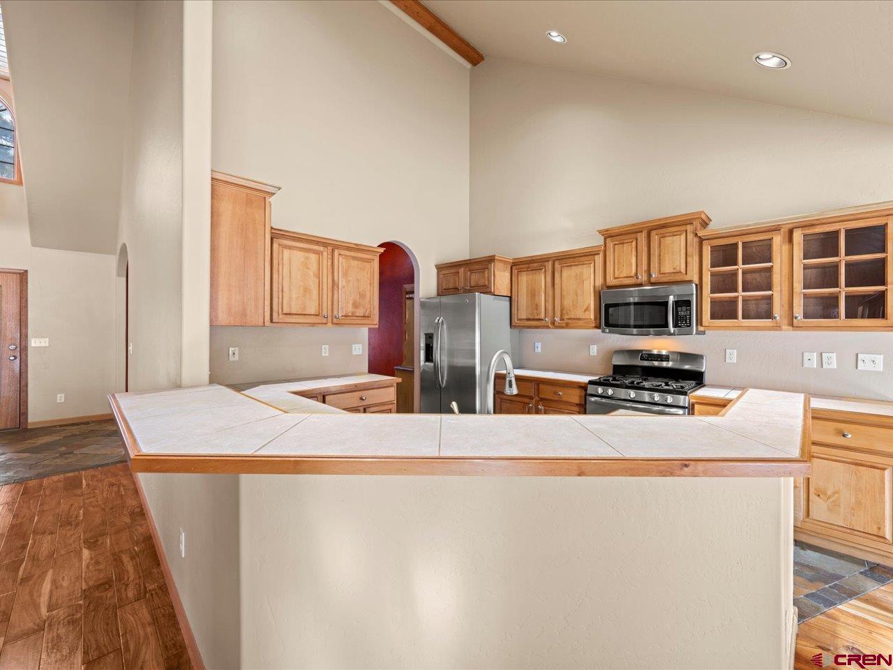 203 Puma Lane Ridgway, CO 81432 - Photo 25 of 43 a kitchen with stainless steel appliances a refrigerator and a stove